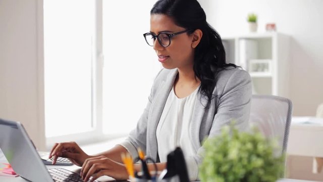 stressed businesswoman with laptop at office