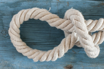 ship rope on wooden background