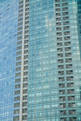 Fototapeta na wymiar Business Modern architecture close up, texture windows of a high rise building