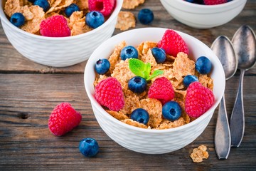 Healthy breakfast: whole grain cereal with raspberry and blueberry