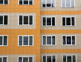 Fototapeta premium Fragment of a new house with ventilated facade made of ceramic tiles