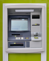 ATM machine on green background