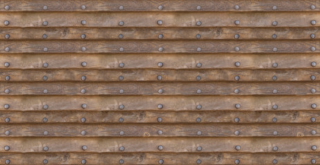 Background horizontal old brown boards with copper rivets in a row symmetrical and smooth texture