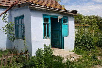 Fototapeta na wymiar An old country house, an abandoned empty house.