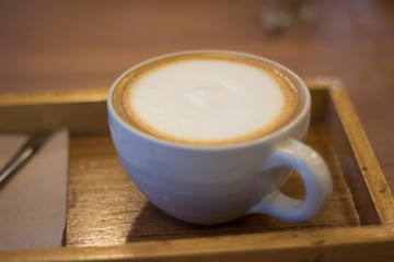 A cup of hot capuchino coffee