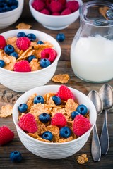 Healthy breakfast: whole grain cereal with raspberry and blueberry