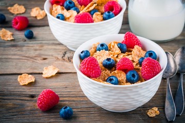 Healthy breakfast: whole grain cereal with raspberry and blueberry