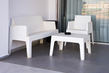 white modern chairs and table outdoors