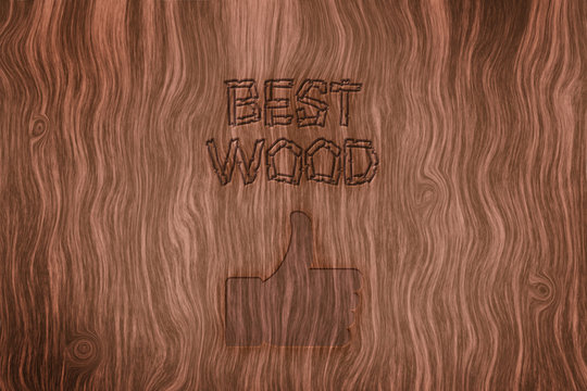A wooden texture on which the inscription of the best wood and a thumb up is scorched. Concept for the sale of wood