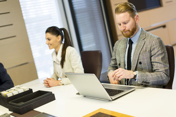 Young business people sitting in the office and working