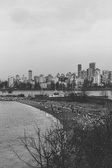 Black and white skyline view of Vancouver BC from Kitsilano Beach.