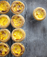 Egg tarts at wooden rustic background