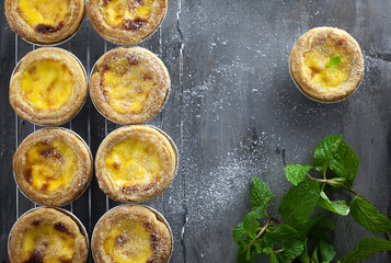 Egg tarts at wooden rustic background