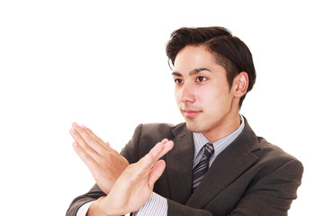 禁止の意思表示をするビジネスマン