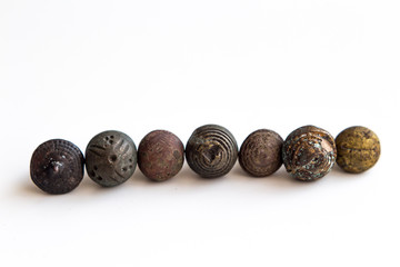 XVII century dress buttons isolated.