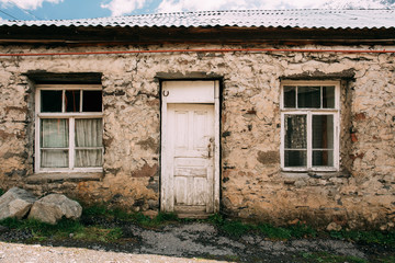 Fototapeta na wymiar Stepantsminda Gergeti, Georgia. Door Of Old House In Village. Ka