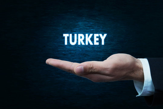Hand holding Turkey word