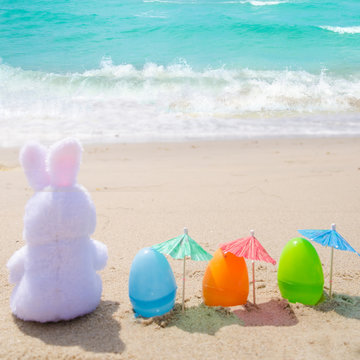 Easter bunny and color eggs on the beach - Instgram format