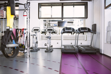 Interior of new modern gym with equipment