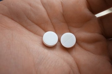 Human hand with pills, closeup