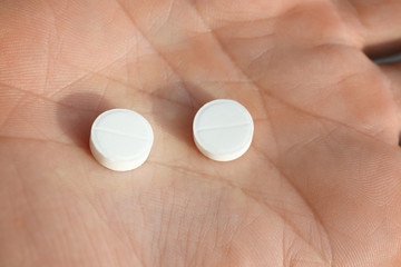 Human hand with pills, closeup