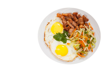 fried egg, meat and vegetable salad. top view. isolated on white