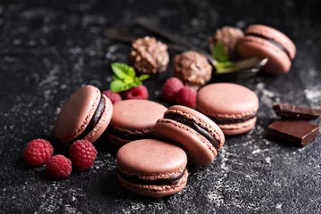 Fototapete Macarons Chocolate and raspberry french macarons with ganache filling