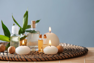 Beautiful spa composition with candles on color background