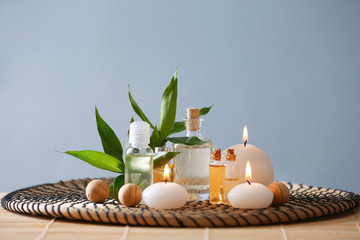 Beautiful spa composition with candles on color background