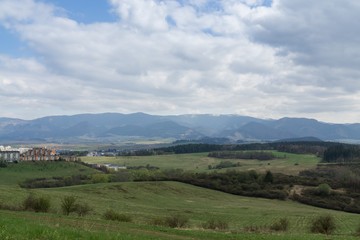 Fototapeta na wymiar Meadow with the view to the Zilina city. Slovakia