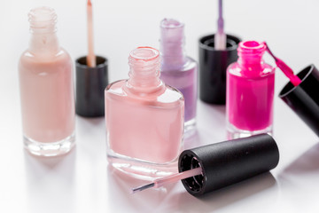 hands care concept with nail polish white desk background