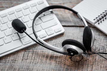 headset and keyboard on workdesk for call center concept