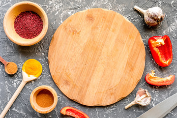 cook work with kitchenware set on dark background top view