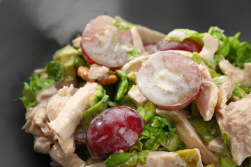 Plate with chicken salad and grapes, closeup
