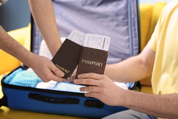 Happy gay couple preparing for trip