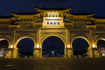 Fototapeta na wymiar Lit main gate at the Chiang Kai-shek Memorial Hall at dusk in Taipei, Taiwan.