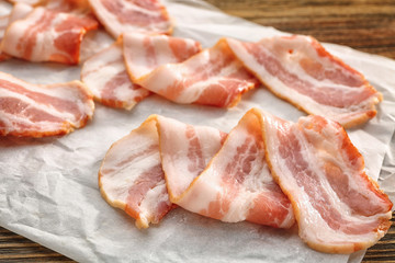 Parchment with strips of fried bacon, closeup