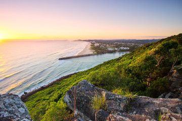 Naklejka premium Sunrise over the ocean at Burleigh Heads National Park looking south towards Palm Beach on the Gold Coast in Queensland, Australia