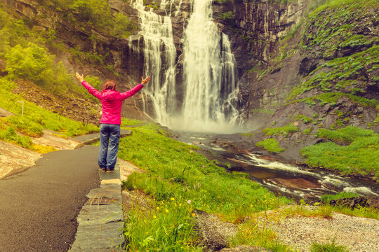Tourist woman by Skjervsfossen Waterfall - Norway