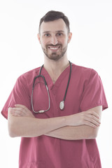 studio portrait of happy male doctor in uniform posing isolated on white background