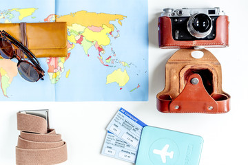 tourist lifestyle with passport and tickets white table background top view