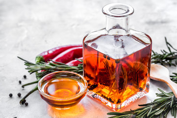 natural oils concept with fresh chili paper on table background