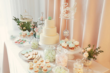 Candy bar. Table with different sweets for party