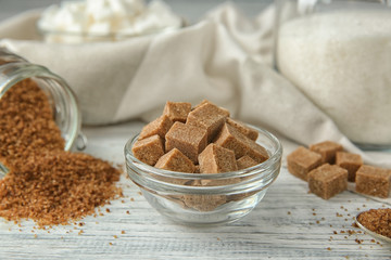 Beautiful composition with sugar on wooden table