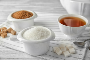 Beautiful composition with sugar on wooden table