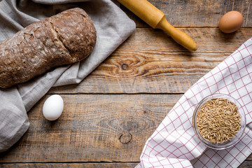 Dried crumbs with bread on kitchen table background top view mokeup