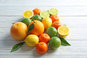 Beautiful composition of citrus fruits on wooden background