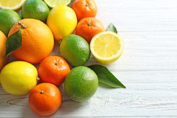 Beautiful composition of tropical fruits on wooden background