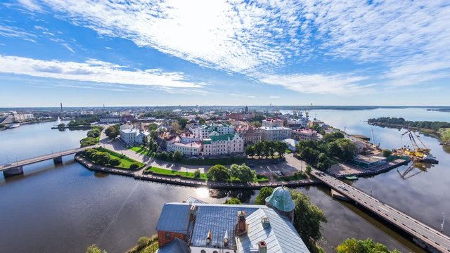 Panoramic aerial view from the tower of St. Olav to the buildings of the Old town, embankment, port. Summer sunny day. Vyborg, Russia.