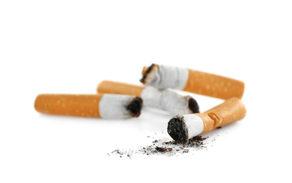 Cigarette butts on white background